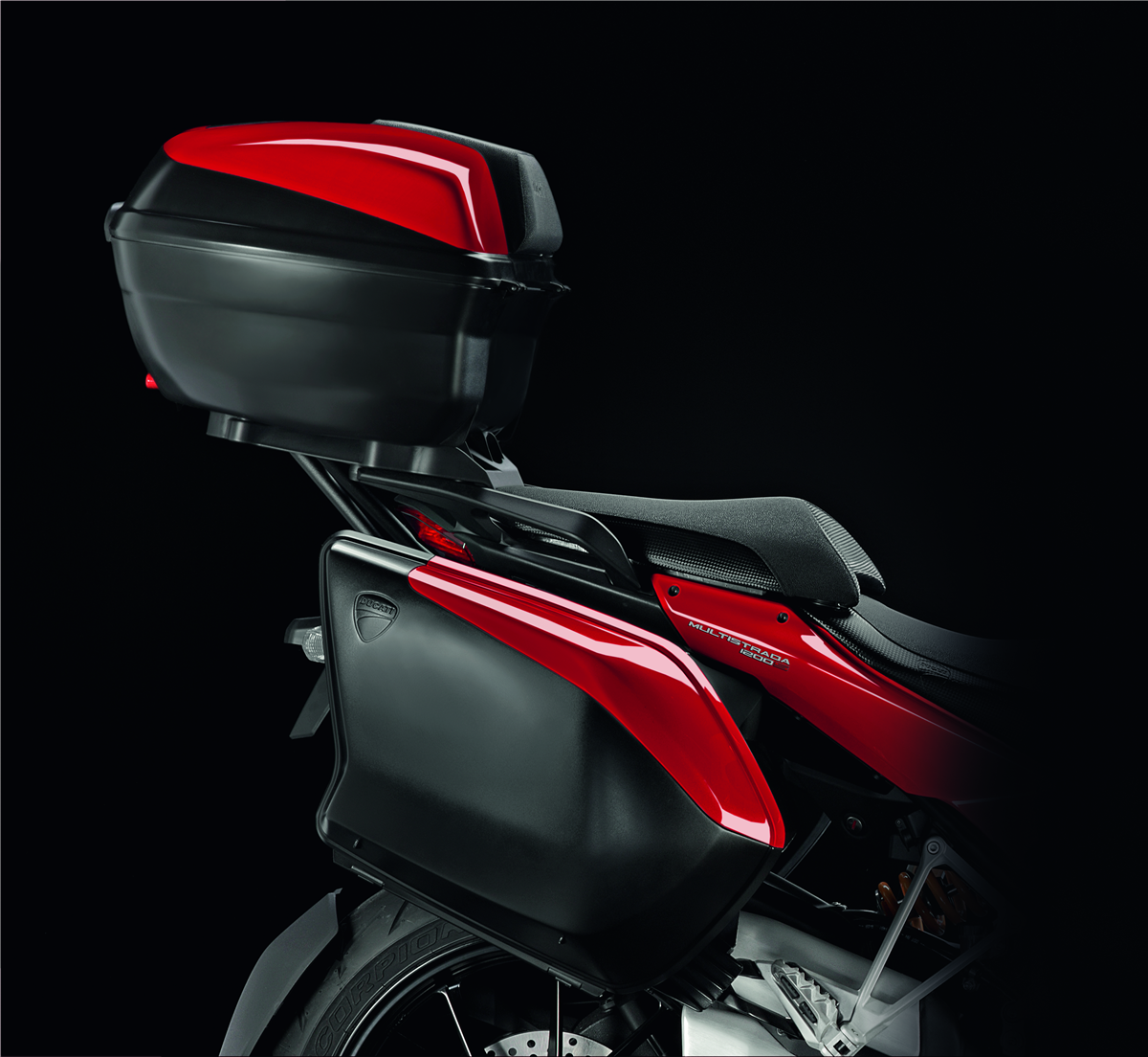 Ducati Top-case with painted cover and quick-release system integrated in  the vehicle.